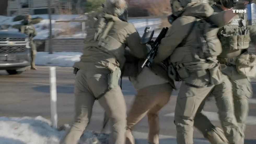 Ice agents try to detain Alex Pretti, days before he was fatally shot, in this screengrab obtained from a video, in Minneapolis