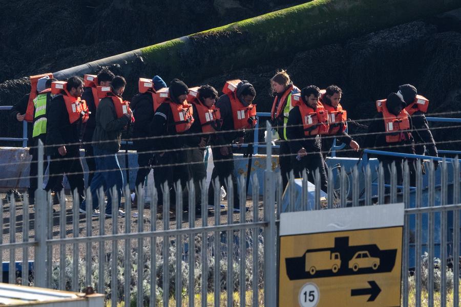 Illegal migrants after landing in Britain