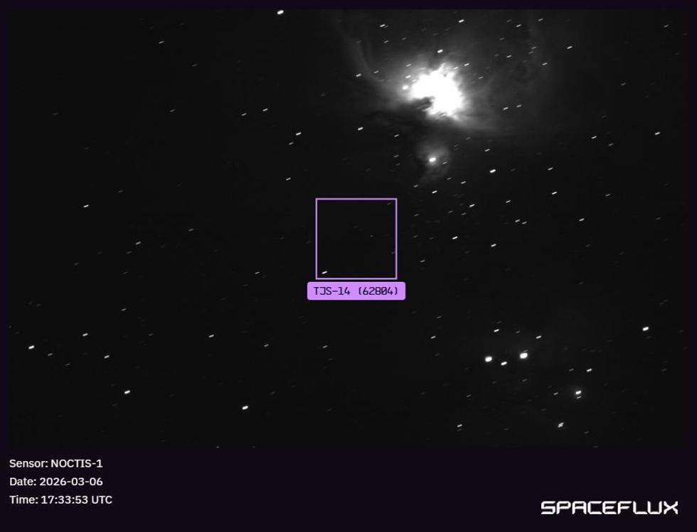 Image of a Chinese TJS-14 satellite on orbit, in front of the Orion Nebula