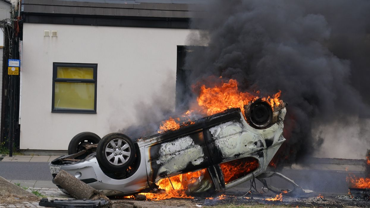 Image of care worker's car on fire