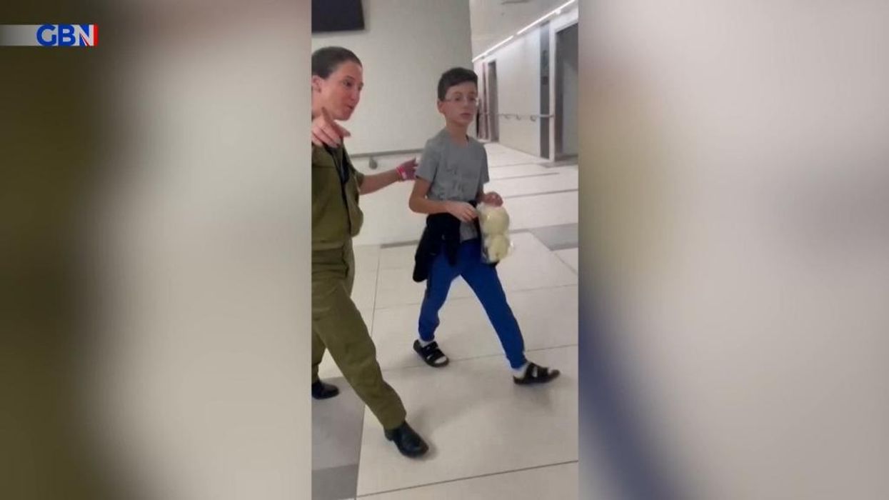 WATCH: The emotional moment nine-year-old hostage runs to hug his dad after release