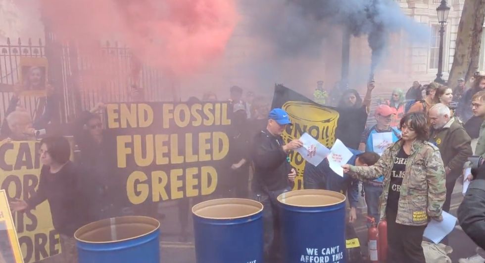 Extinction Rebellion protest outside Downing Street cheer as Kwarteng sacked