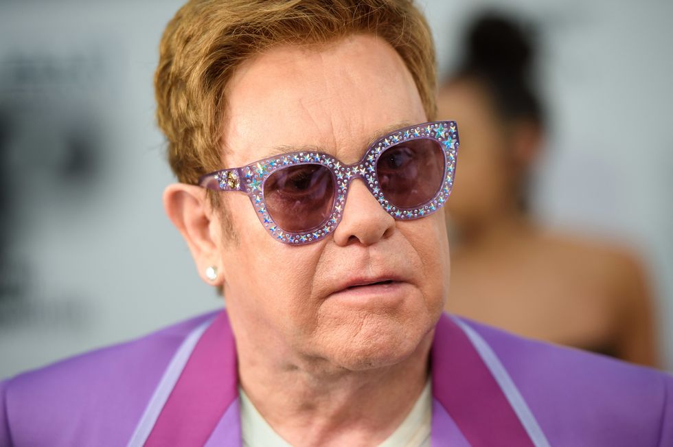 Sir Elton John tests positive for Covid-19 and reschedules shows