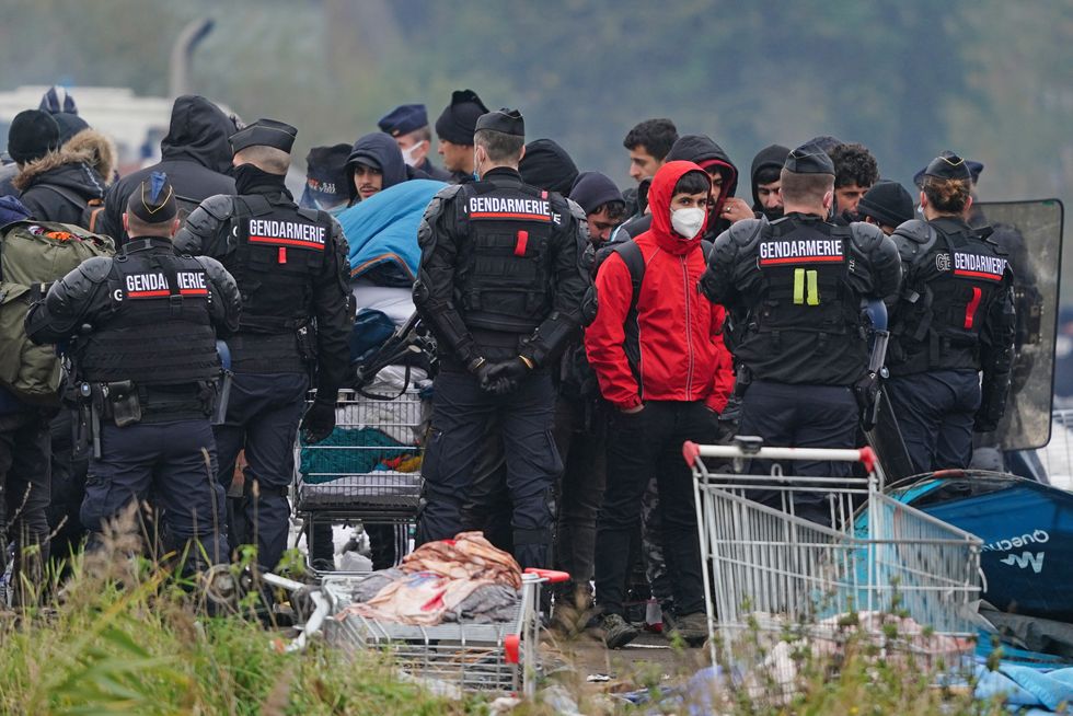 Migrant camp evicted by French police as hundreds forced to move on