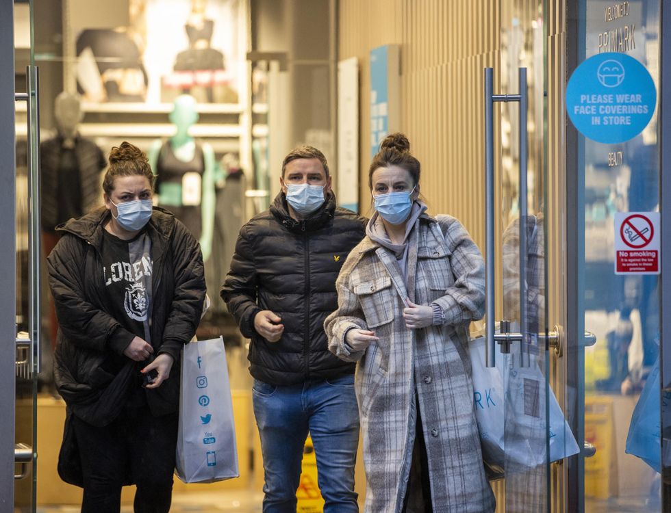 Shoppers and commuters still asked to wear masks despite law change