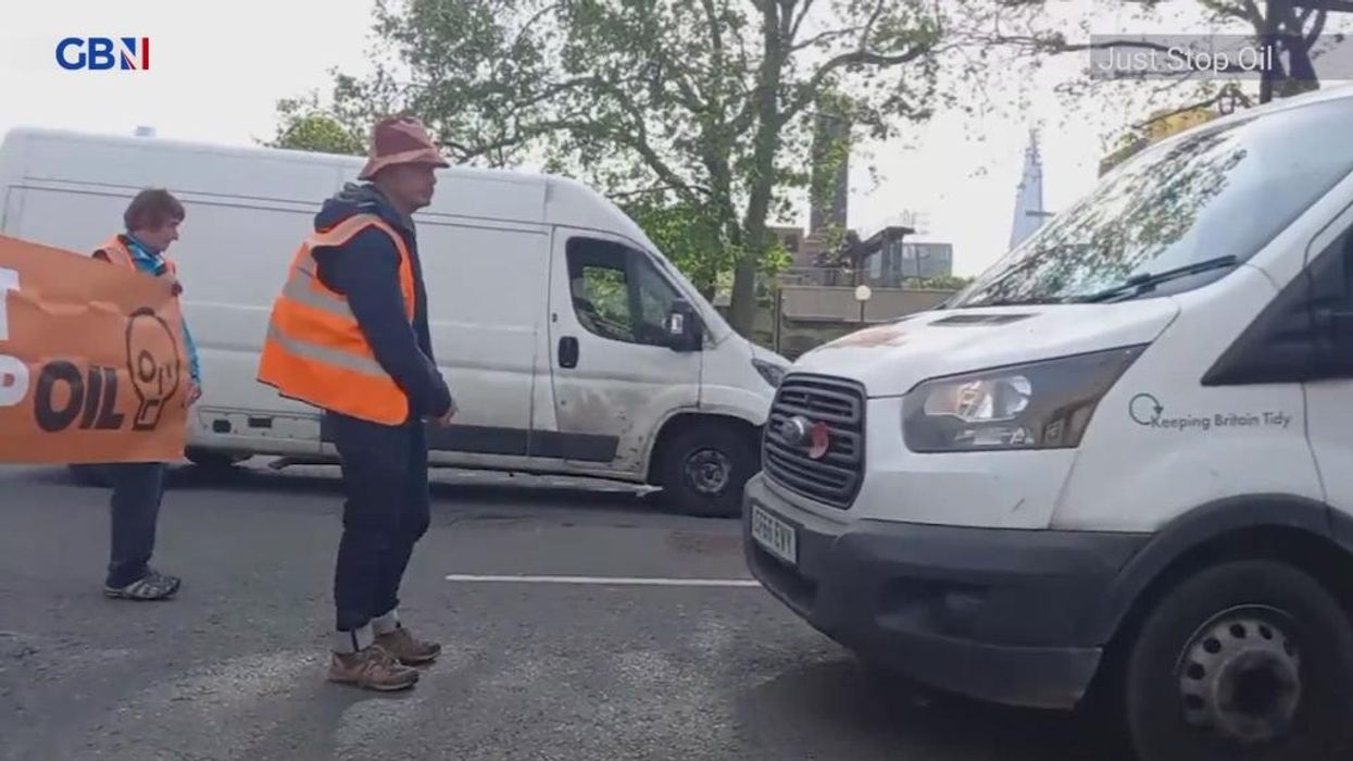 Motorist pushes Just Stop Oil protester to the ground before being HANDCUFFED by police