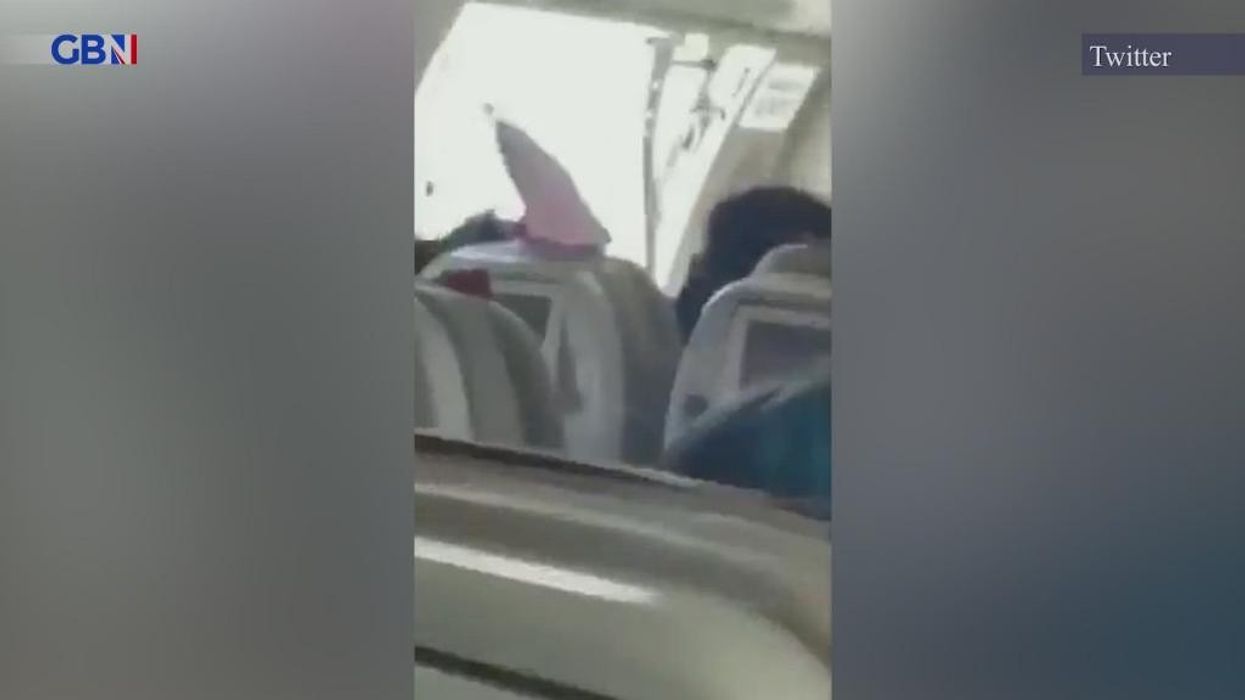 Watch: Terrifying moment man opens plane door in mid-air on Asiana Airlines flight