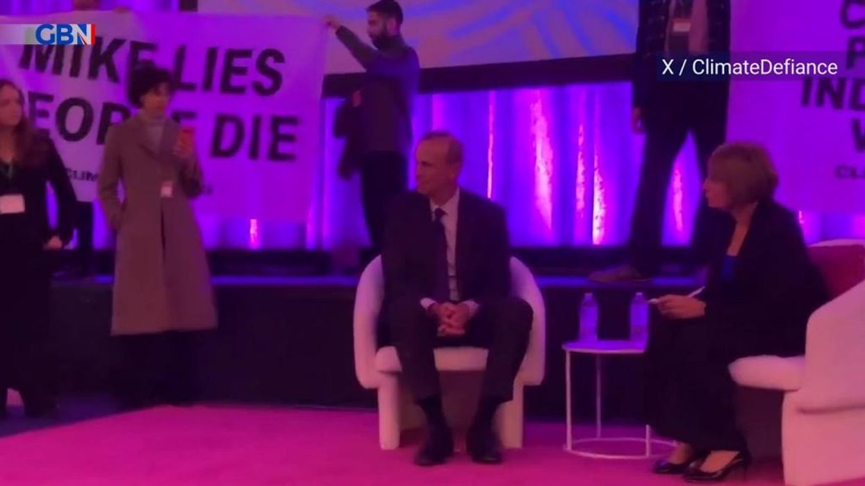 WATCH: Eco-zealots storm stage to furiously confront Chevron boss - 'You are killing people!'