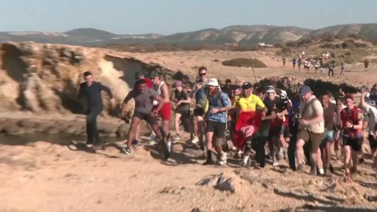 'Hardest Geezer' Russ Cook crosses line in Tunisia to complete run across Africa