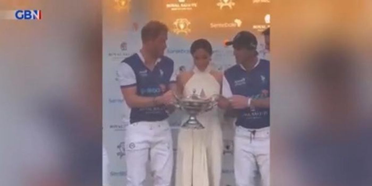 NextImg:WATCH: Harry and Meghan share passionate kiss at charity polo match