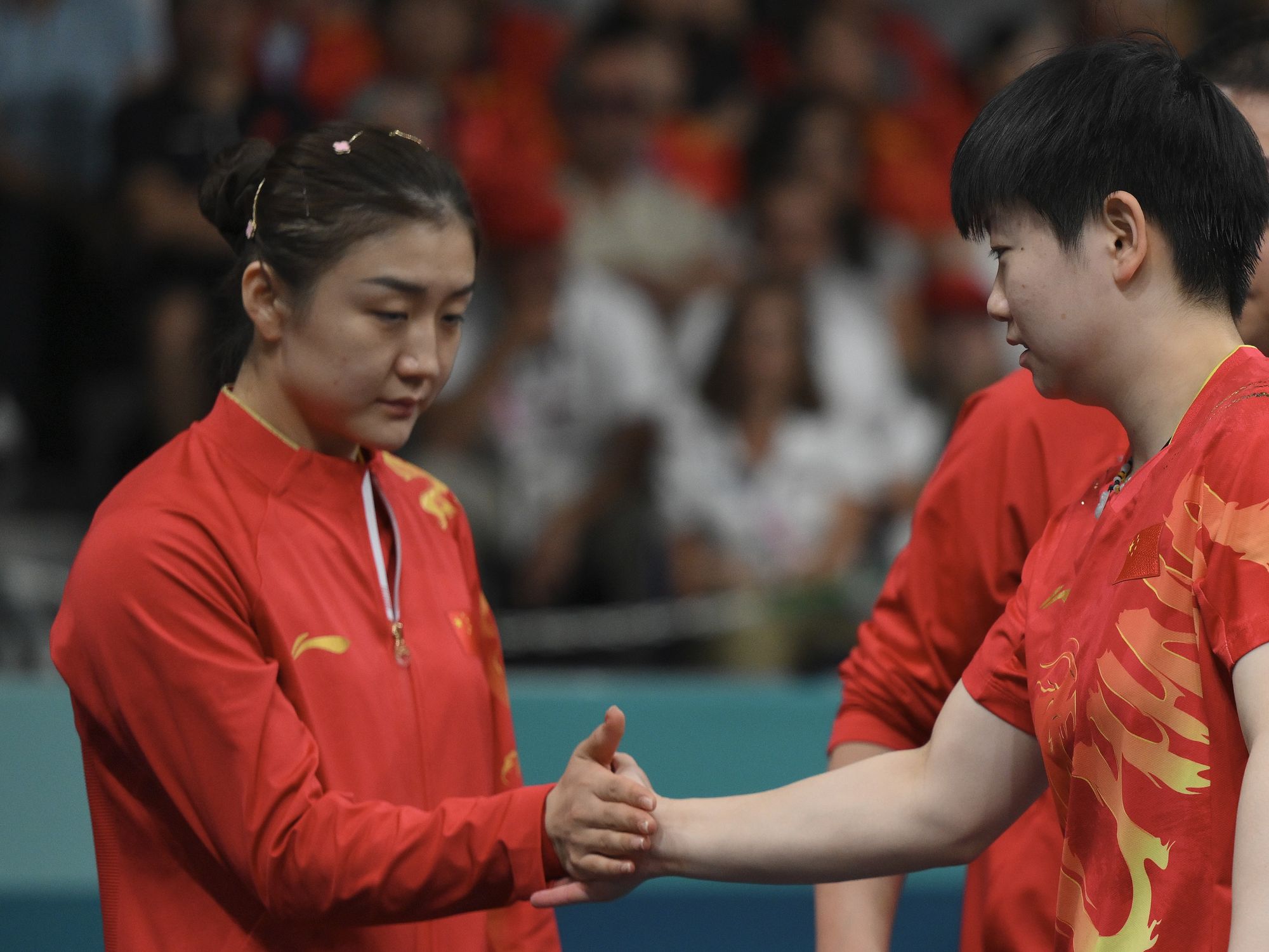 China arrests woman for 'slanderous' comments made about Olympic athletes after divisive table te...