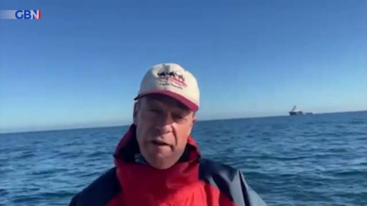 Nigel Farage blasts Labour's migrant efforts after spotting a small boat in the Channel