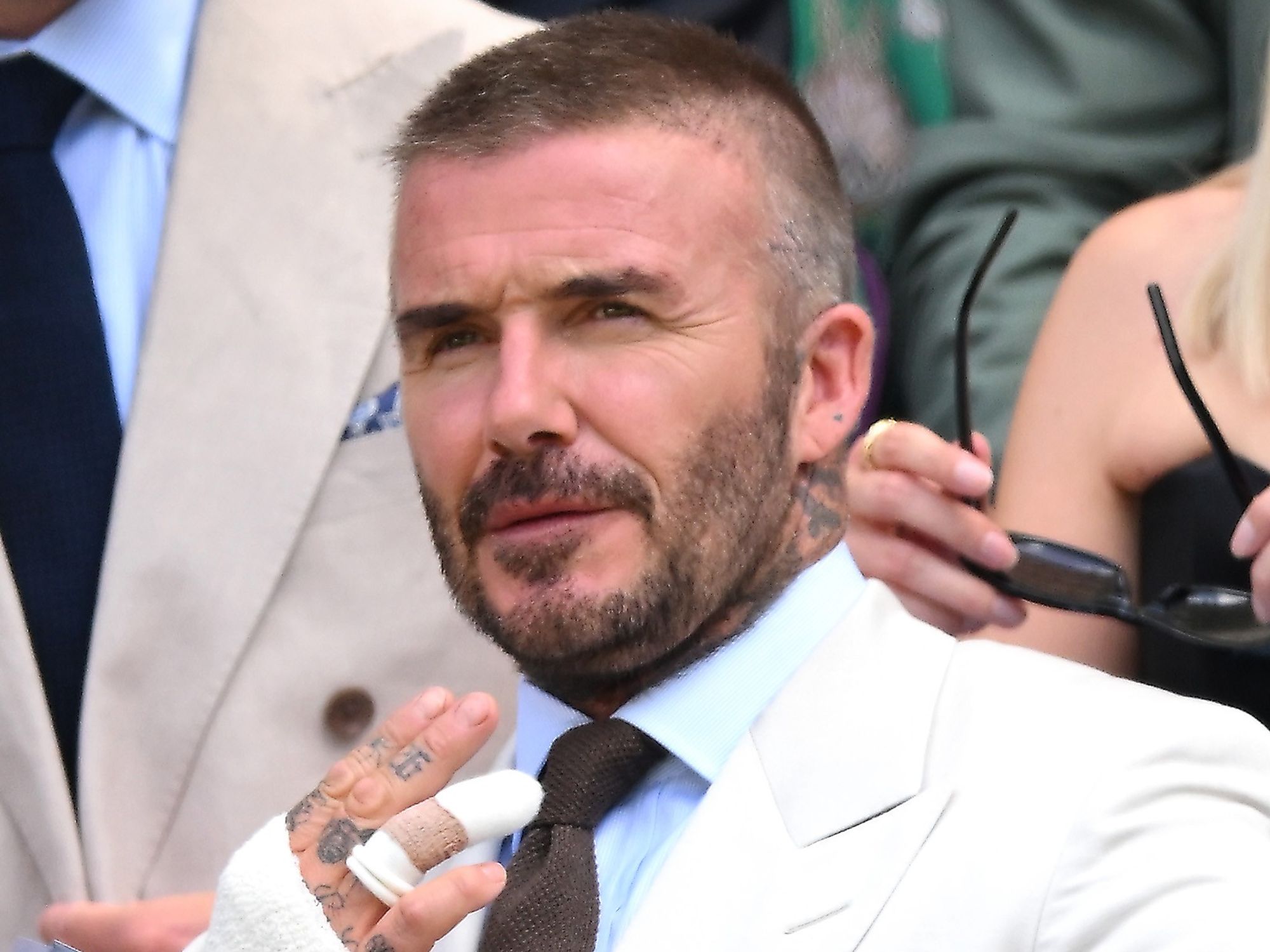 Royal Family grant Sir David Beckham fresh privilege as he is pictured with hand bandaged followi...