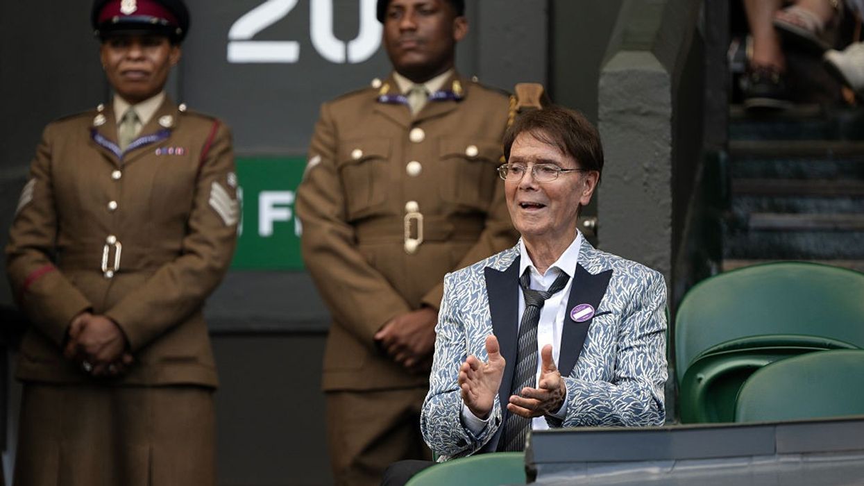 Sir Cliff Richard, 84, delights fans as he steps out all smiles during rare public outing at Wimbledon