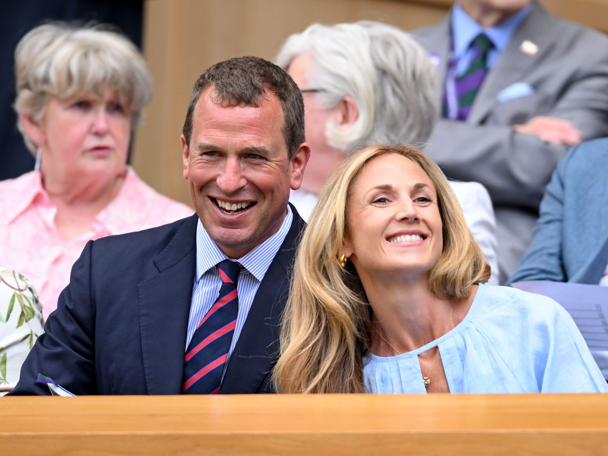 Princess Anne's son and his girlfriend attend Wimbledon but sit away from Queen Camilla