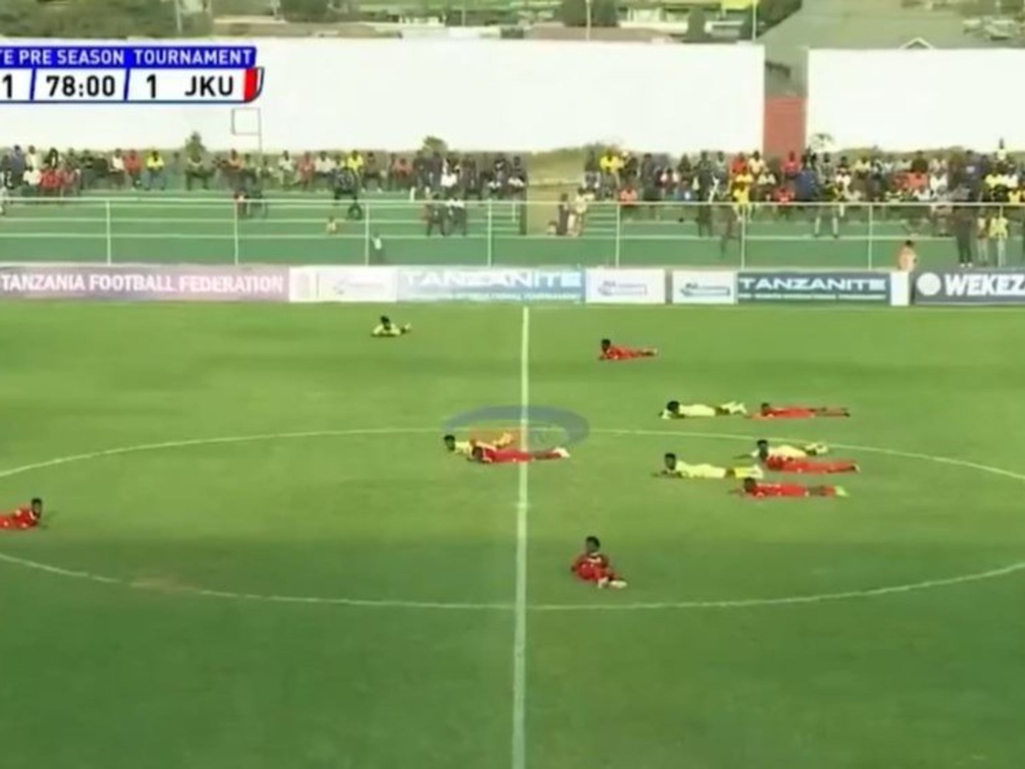 Football match suspended with panicked players, staff and officials forced to lie down on the floor