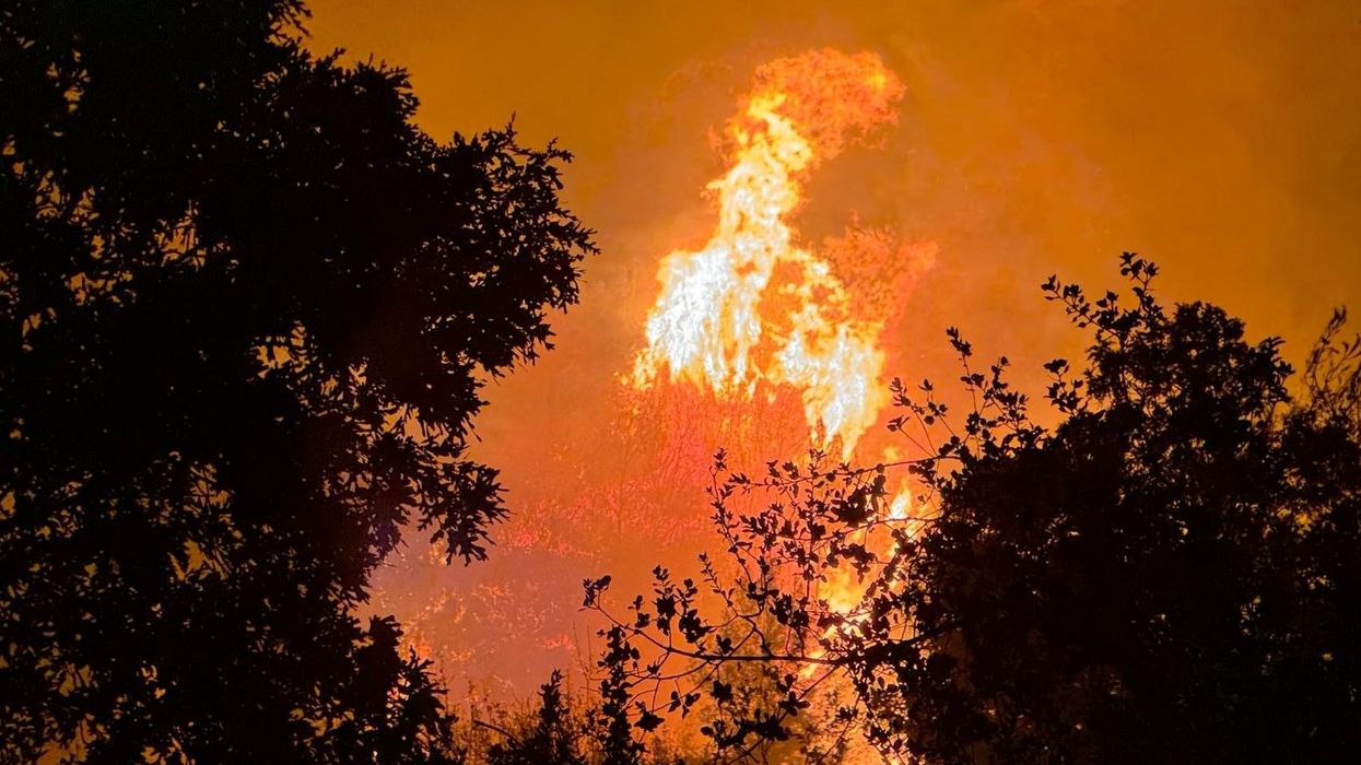 Devastating fire rips through holiday hotspot with tourists forced to evacuate hotels