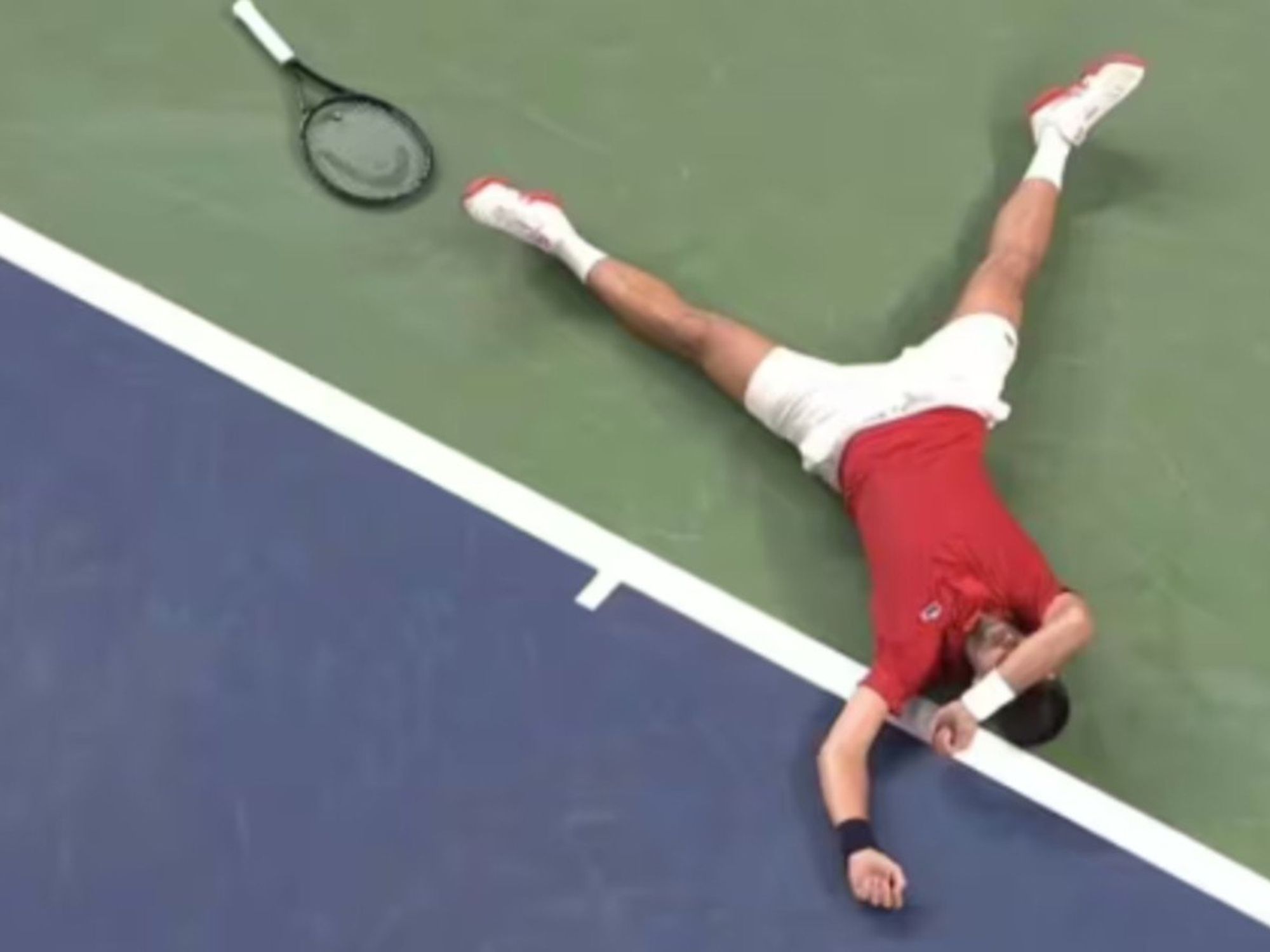 Novak Djokovic collapses on the court during Shanghai Masters tennis match