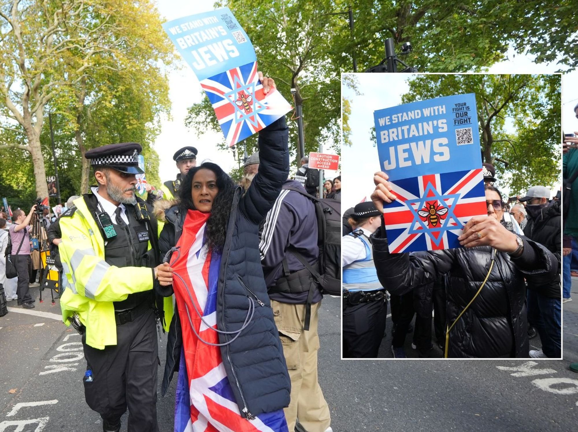 Police remove people carrying placards saying 'we stand with Britain's Jews' as pro-Palestine pro...