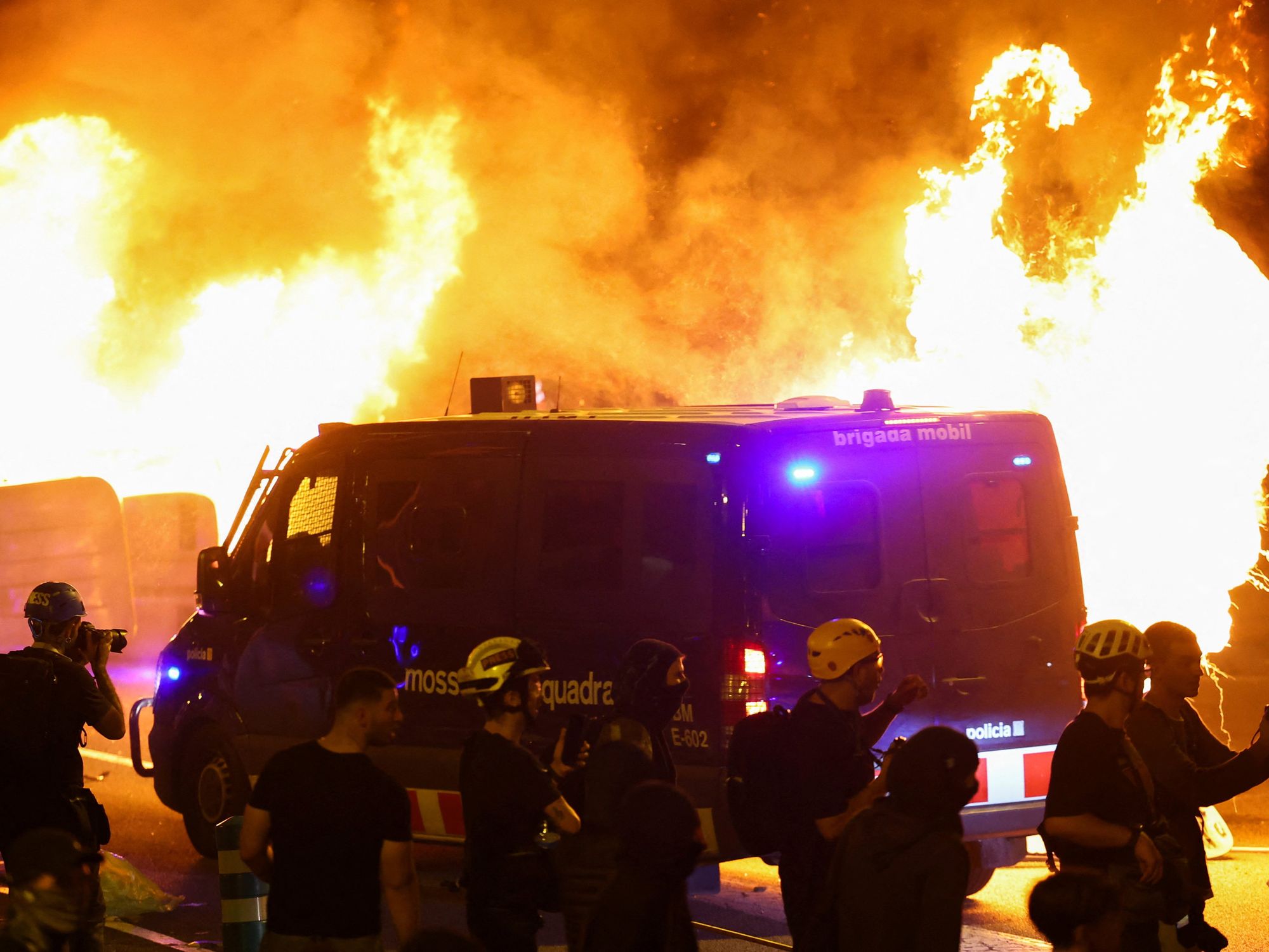 Pro-Palestine mobs trash Spain tourist hotspot as police cars burn and violent clashes erupt