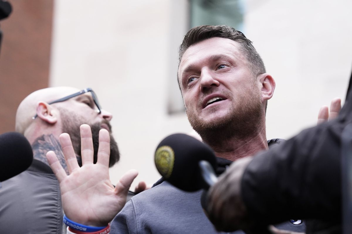 Tommy Robinson cleared of terror charge after failing to provide police with mobile phone pin