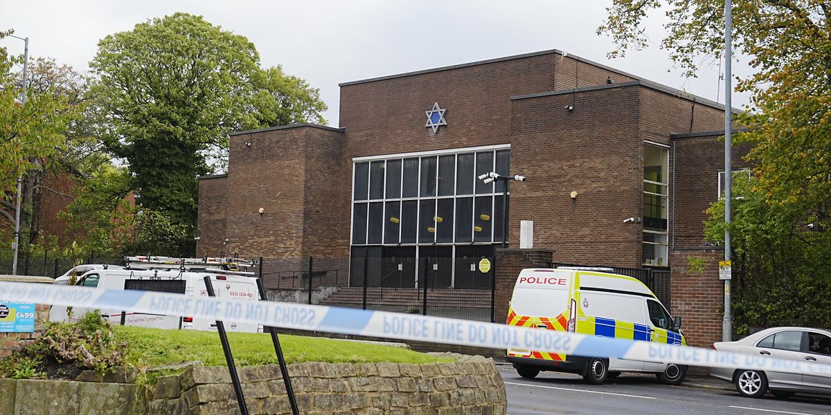 Man, 31, arrested on suspicion of preparing terror acts in connection to Manchester synagogue attack after landing at UK airport Man, 31, arrested on suspicion of preparing terror acts in connection to Manchester synagogue attack after landing at UK airport