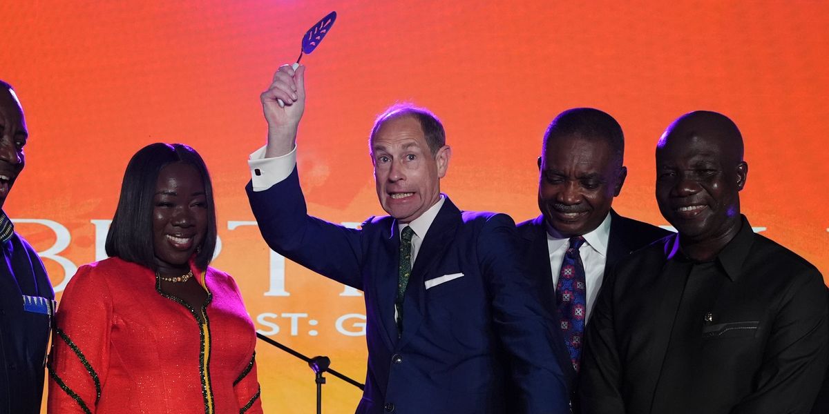 Prince Edward waves knife above his head in flamboyant cake cutting ceremony Prince Edward waves knife above his head in flamboyant cake cutting ceremony