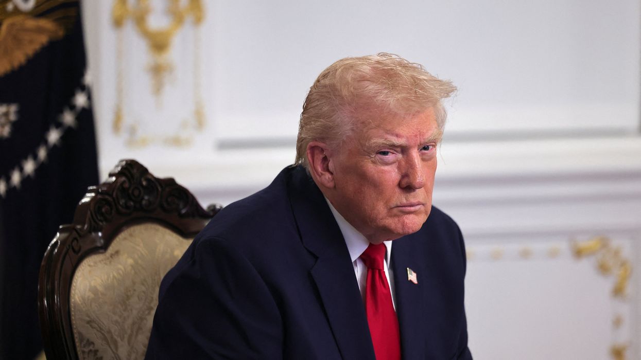 America stops all asylum decisions just hours after Donald Trump's promise to shut out 'third world countries'