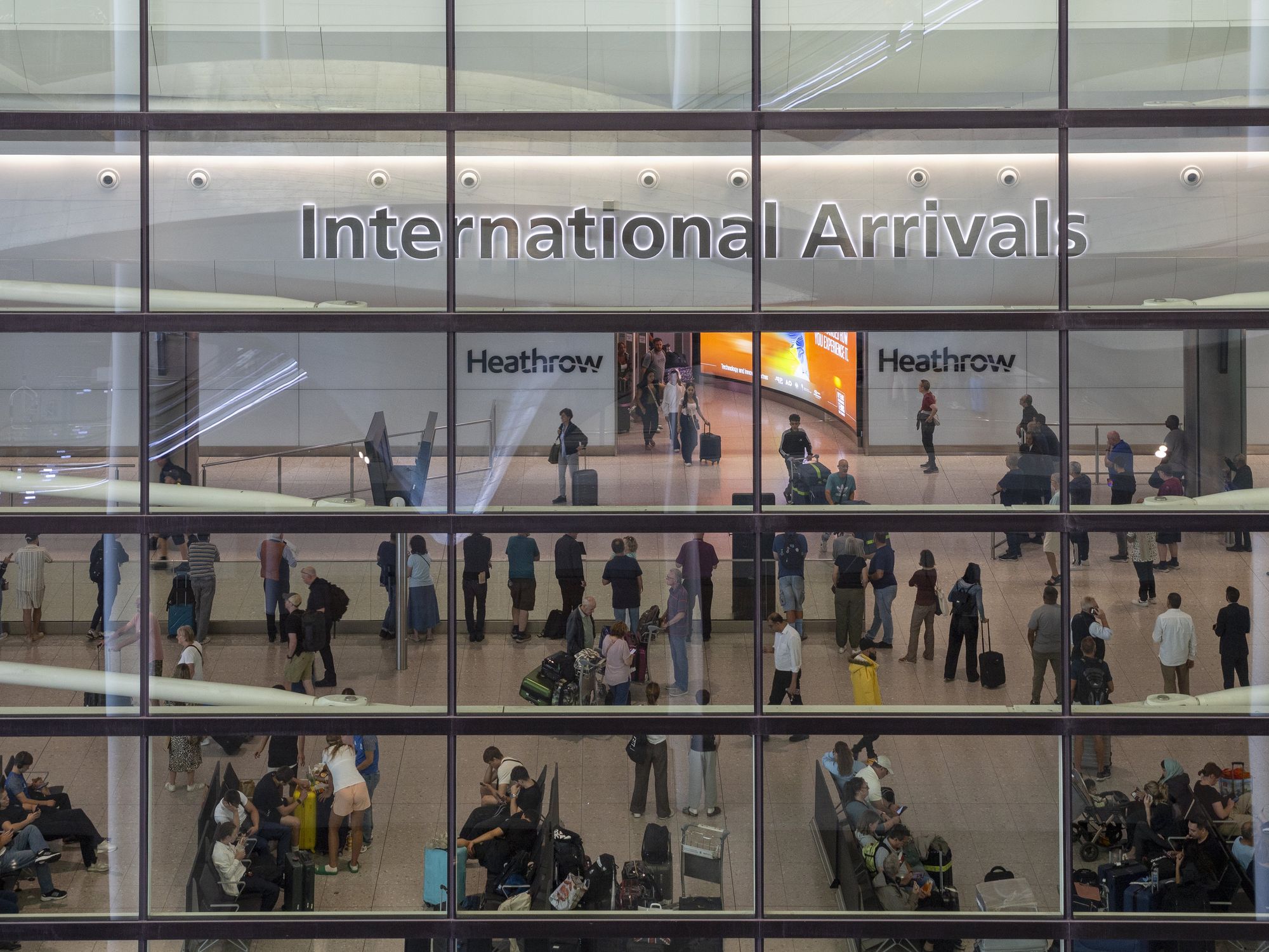 Heathrow Airport terminal 'locked down' as armed police rush to scene