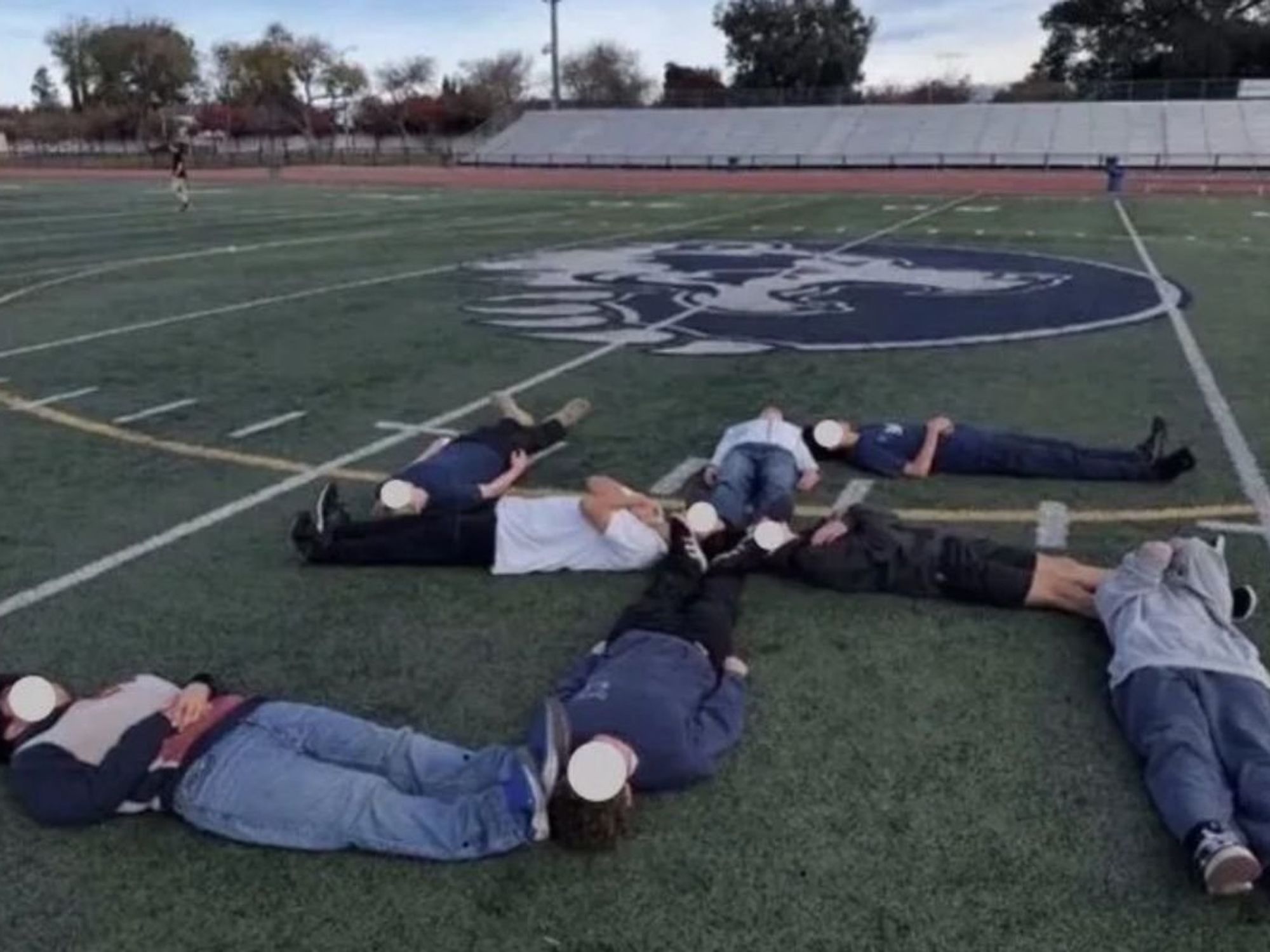 Students form 'human swastika' on school football field in 'disturbing and unacceptable act of an...
