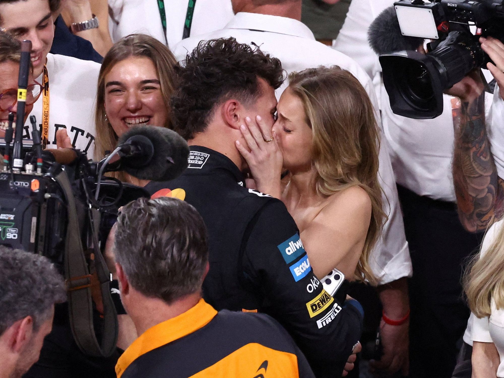 Lando Norris's girlfriend insists celebratory kiss 'not for the cameras' after relationship made public