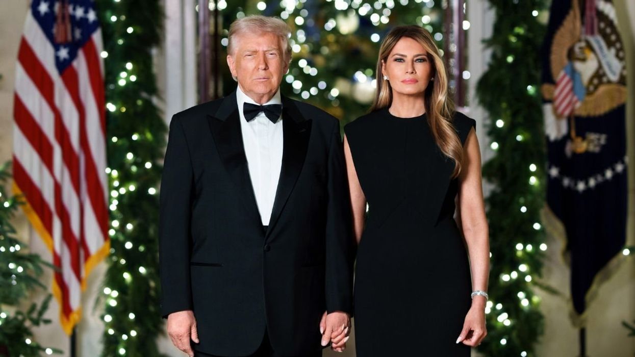PICTURED: Donald Trump poses for White House Christmas portrait alongside wife Melania