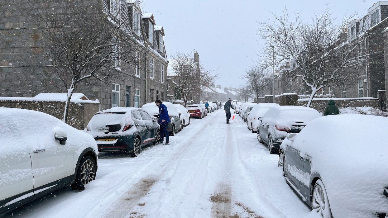 Hundreds of schools closed across Britain as parts of UK blanketed with snow amid amber warnings