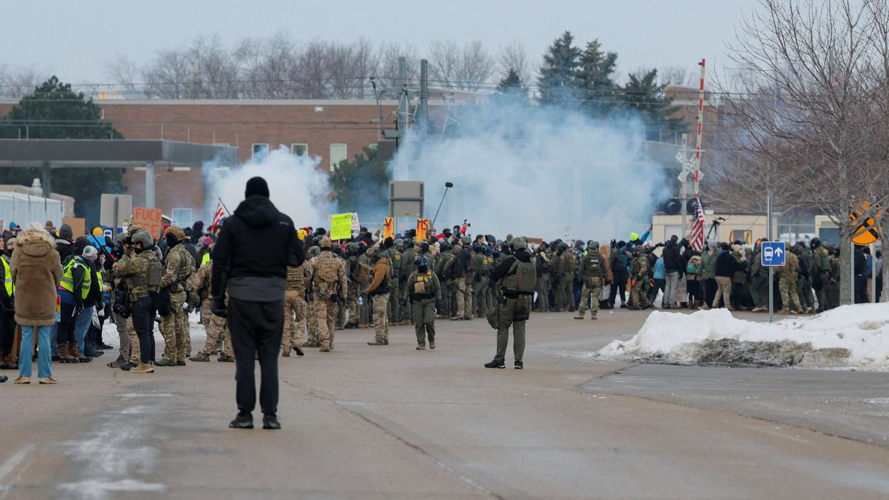 Protesters clash with riot police in Minneapolis after woman shot in head by Ice agent