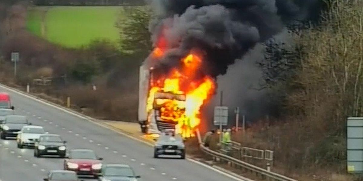 Lorry bursts into flames on side of the motorway as terrified drivers watch in horror Lorry bursts into flames on side of the motorway as terrified drivers watch in horror