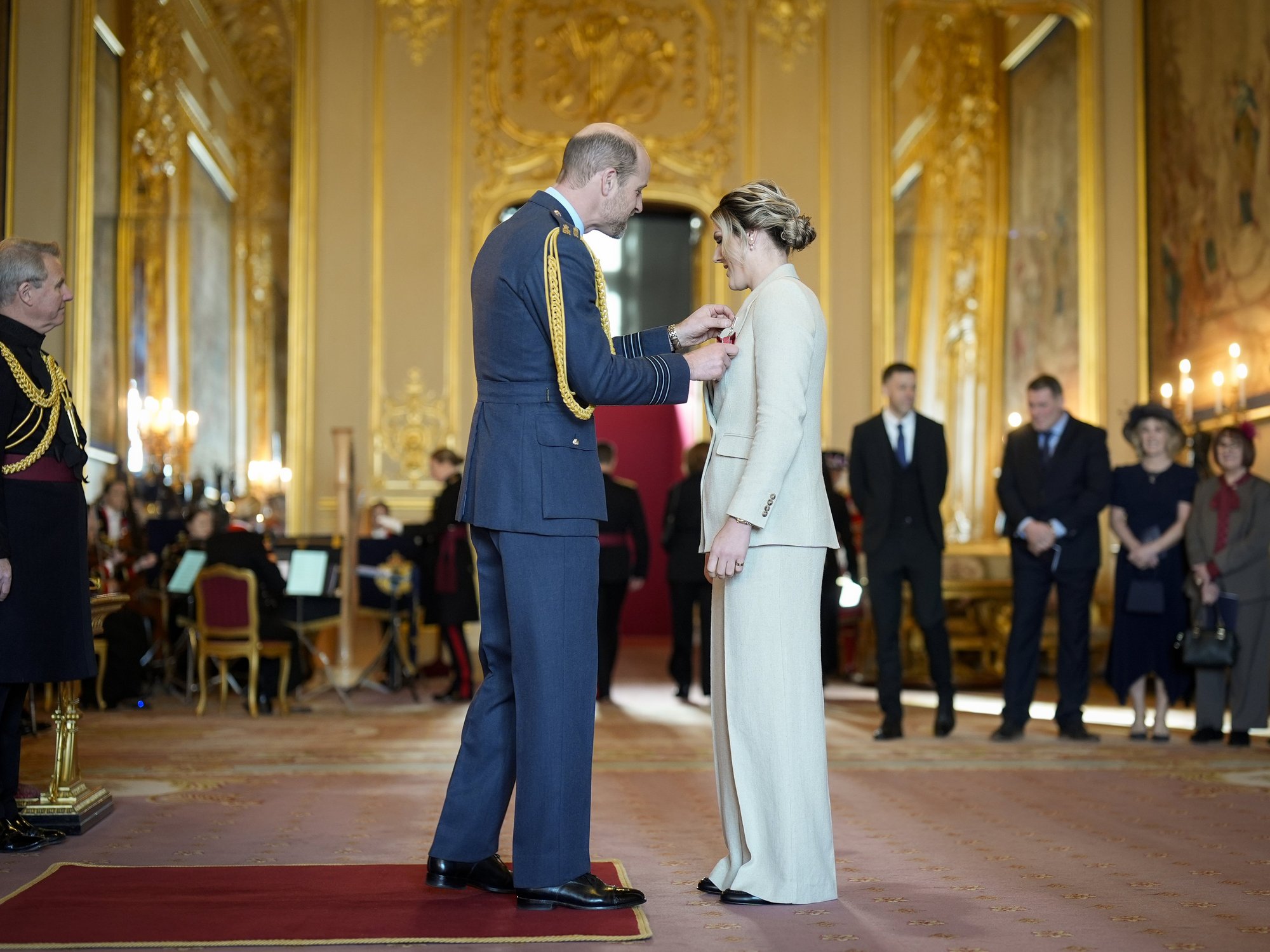 England legend skips training session to receive OBE from Prince William