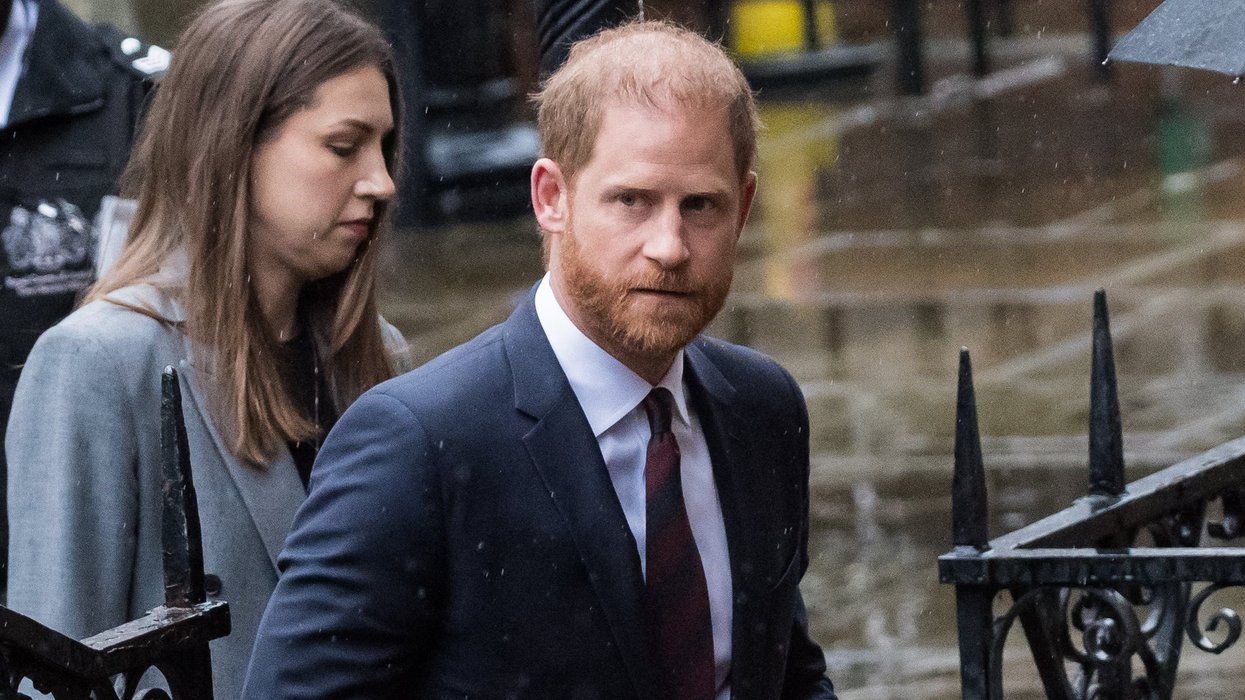 Prince Harry fights back tears as he accuses publisher of making Meghan Markle's life an 'absolute misery'