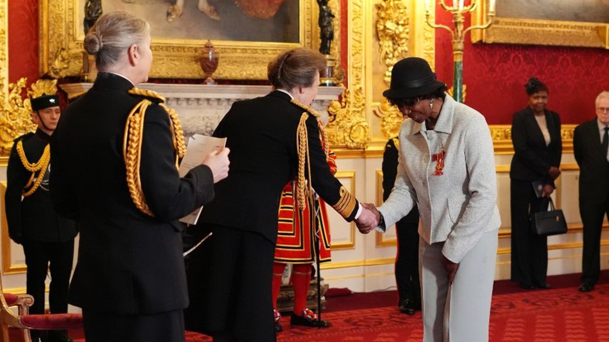 Darts world champion 'overwhelmed' after receiving OBE from Princess Anne