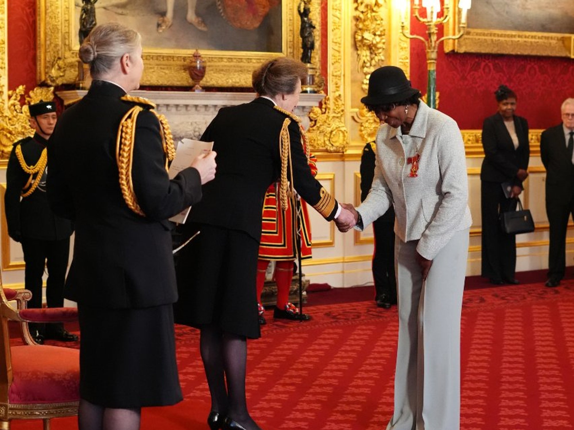 Darts world champion 'overwhelmed' after receiving OBE from Princess Anne