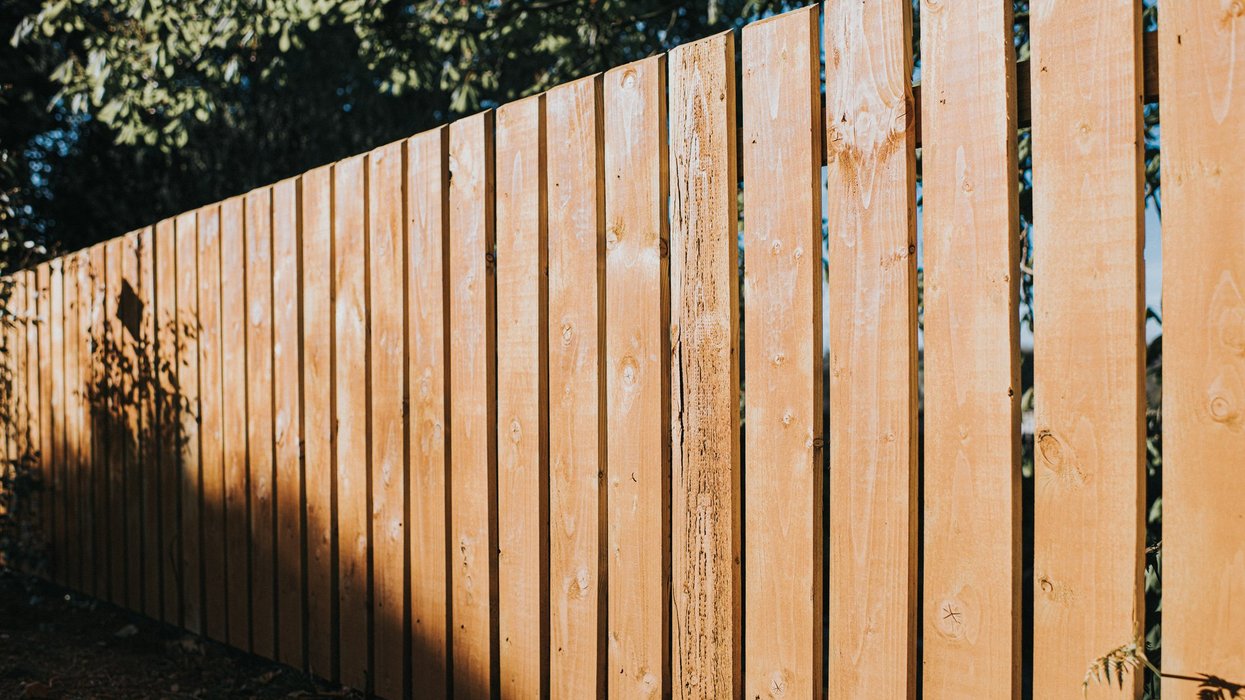 Retired teacher embroiled in row with neighbour 'stealing garden and ripping up decking'