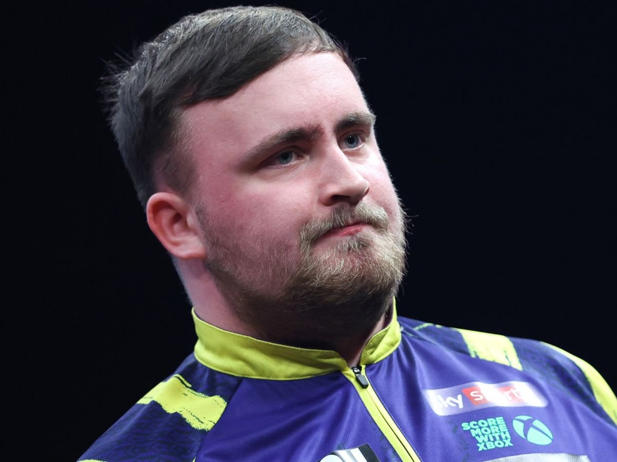 Luke Littler blasts 'idiot' in crowd after continuing charge towards Masters title