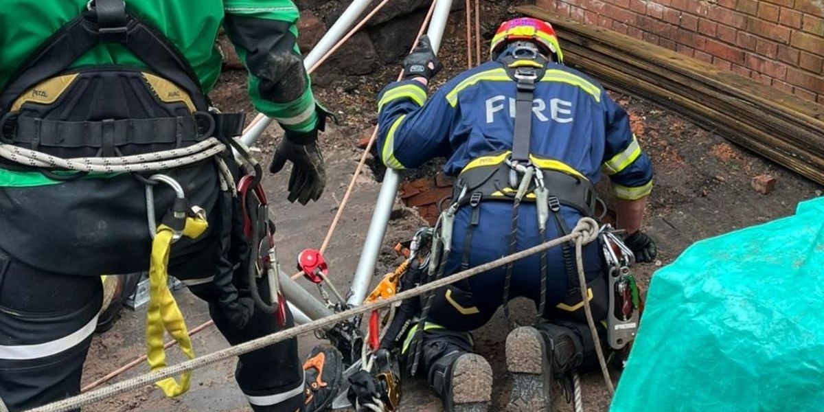 Man plunges 30ft down well on English high street as emergency crews race to rescue Man plunges 30ft down well on English high street as emergency crews race to rescue