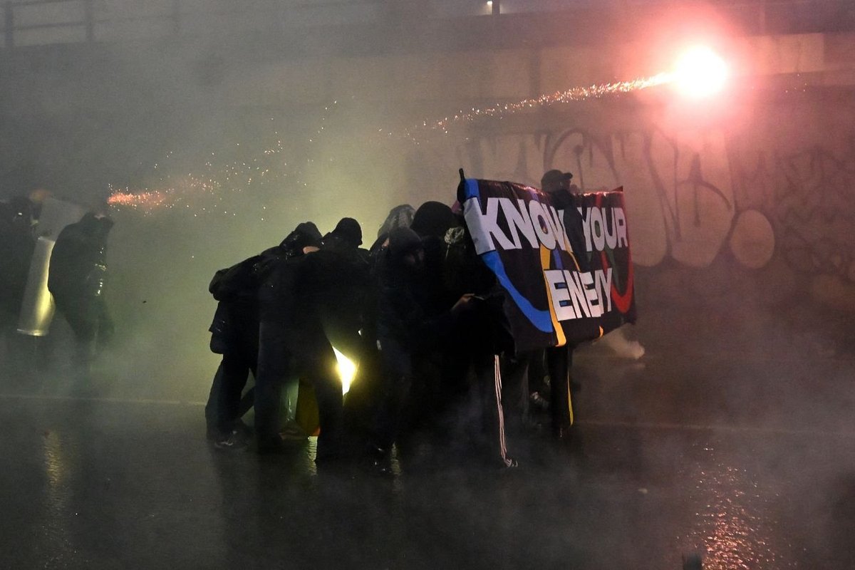 Winter Olympics struck by mass protests in Milan as fireworks and flares fly in dramatic scenes