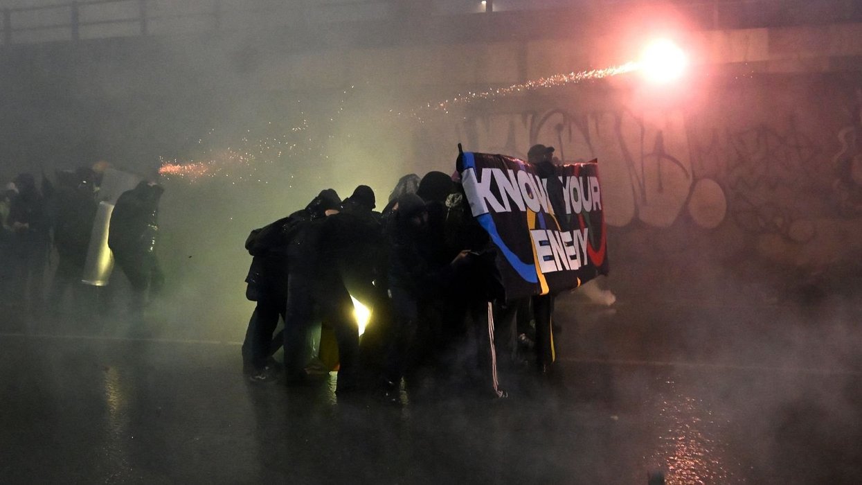 Winter Olympics struck by mass protests in Milan as fireworks and flares fly in dramatic scenes