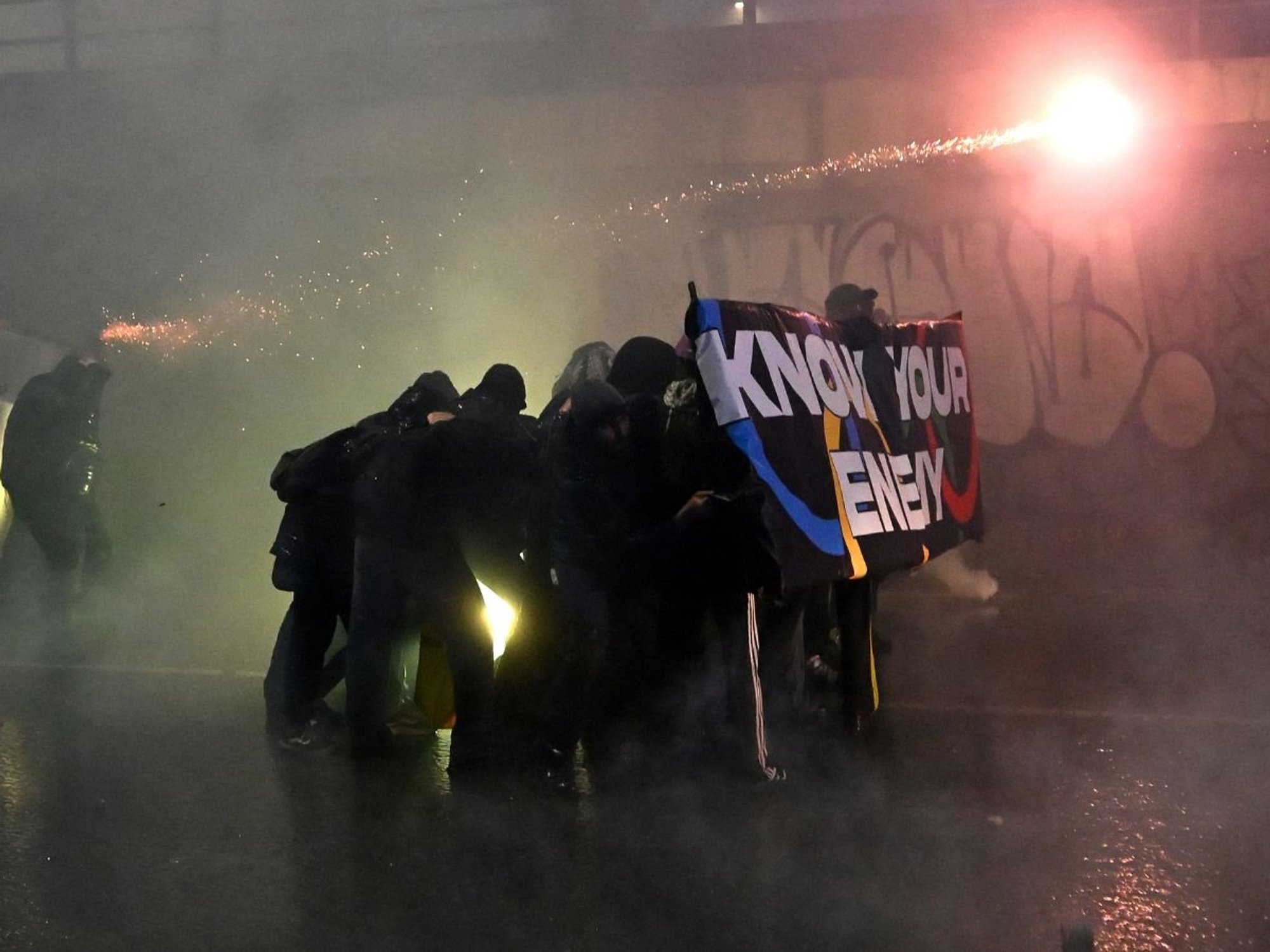 Winter Olympics struck by mass protests in Milan as fireworks and flares fly in dramatic scenes