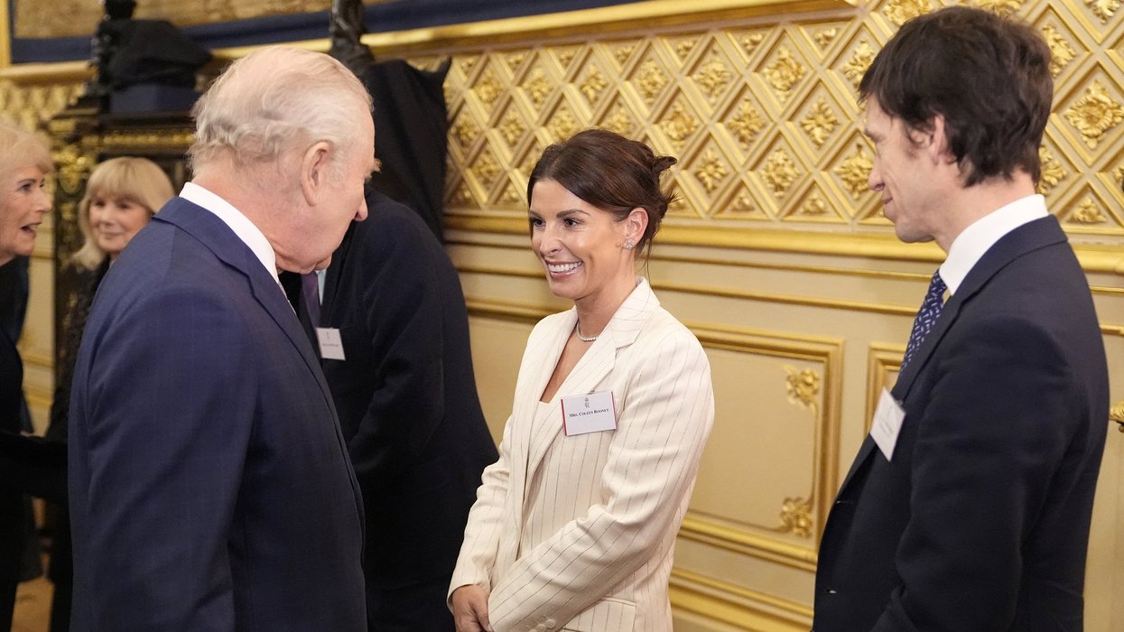 Coleen Rooney performs a curtsy during meeting with King Charles at Windsor Castle for special event