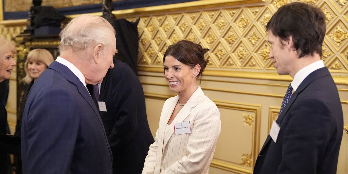 Coleen Rooney performs a curtsy during meeting with King Charles at Windsor Castle for special event Coleen Rooney performs a curtsy during meeting with King Charles at Windsor Castle for special event