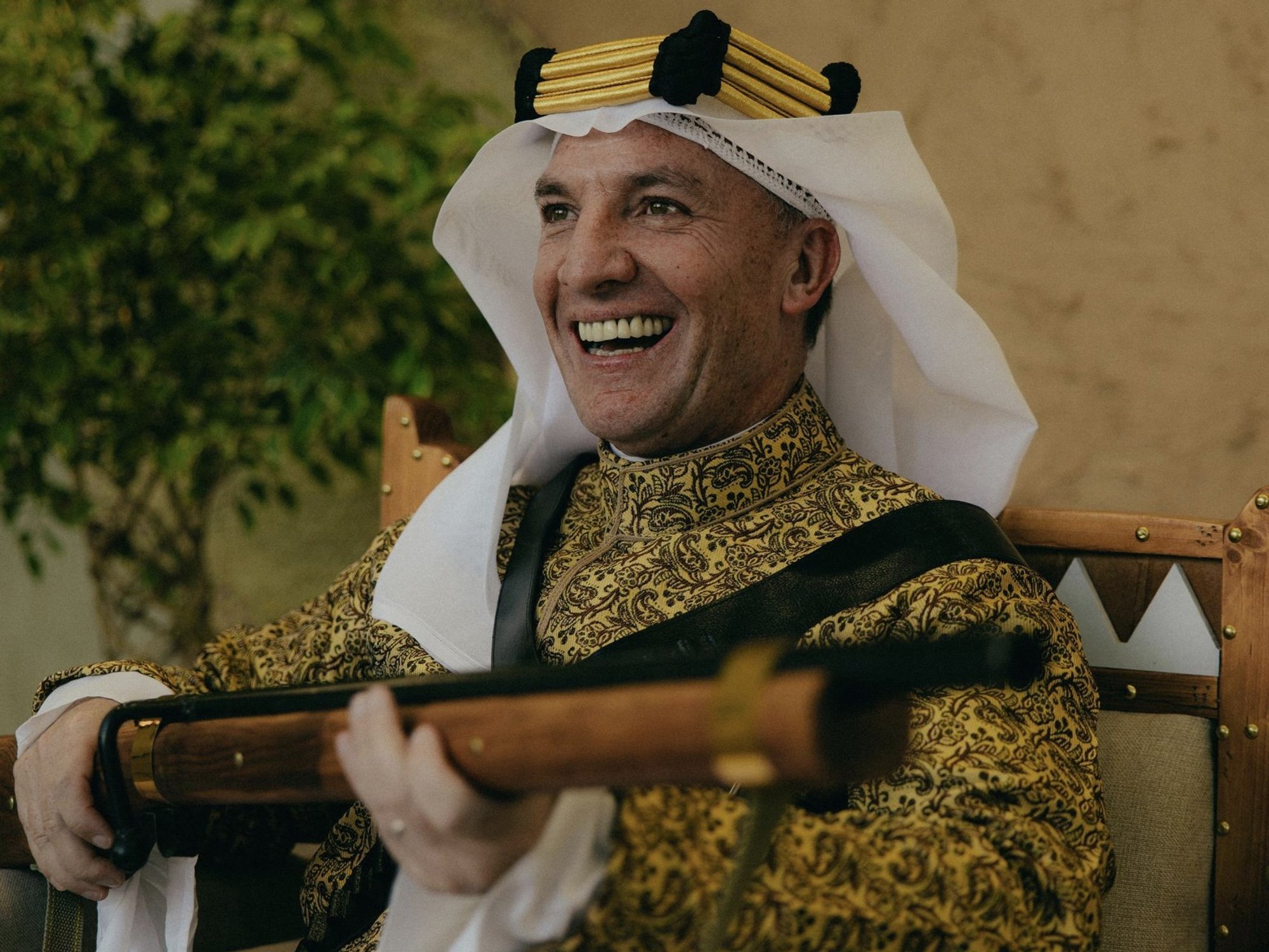 Former Liverpool boss gives bizarre interview holding gun dressed in Saudi attire
