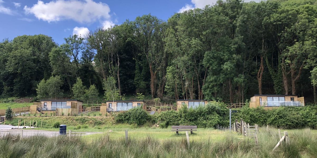 Planning row erupts after developer refuses to demolish Airbnb cabins deemed eyesore from public footpath Planning row erupts after developer refuses to demolish Airbnb cabins deemed eyesore from public footpath