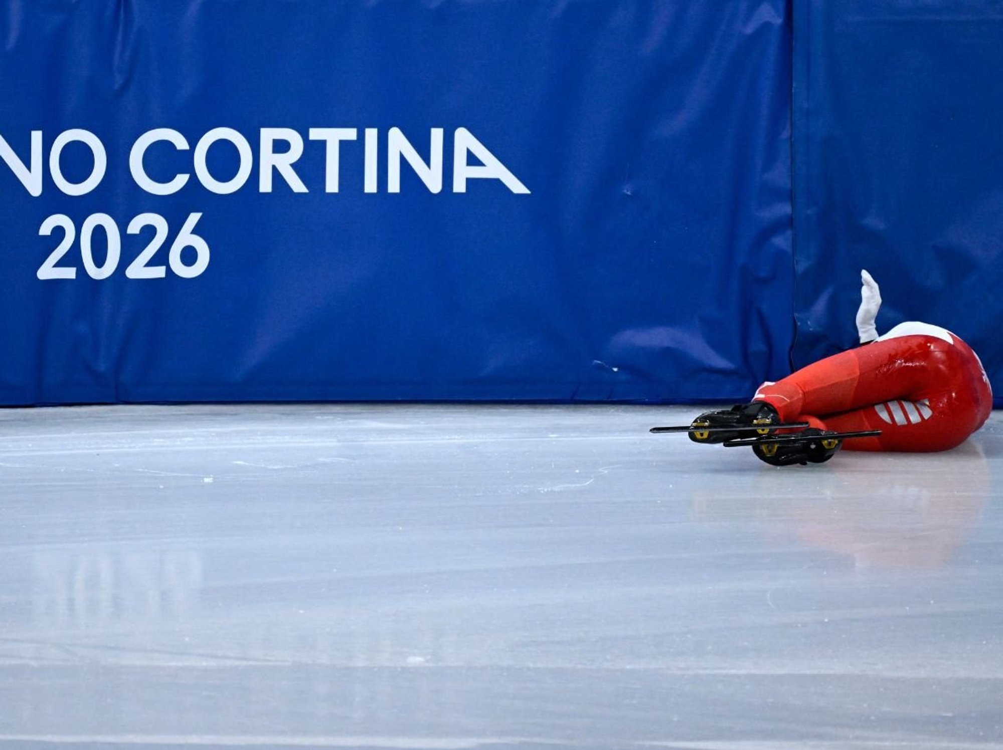 Winter Olympics star hides face after returning home following horror skating crash